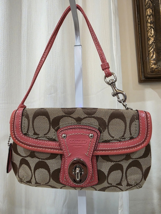Coach Handbags - vintage Coach Legacy Signature jacquard turnlock wristlet in brown and pink.